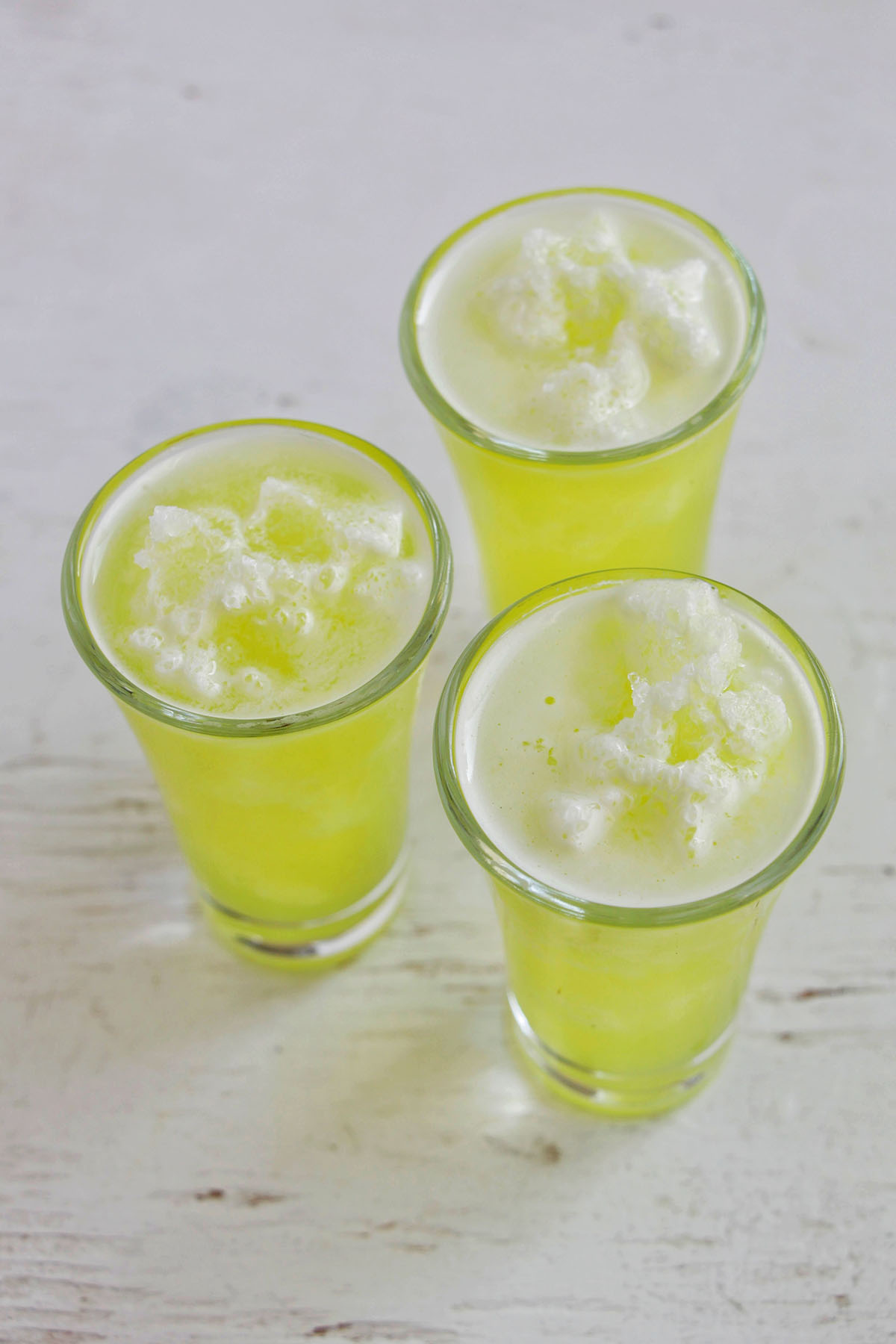 three green frozen margarita shots.
