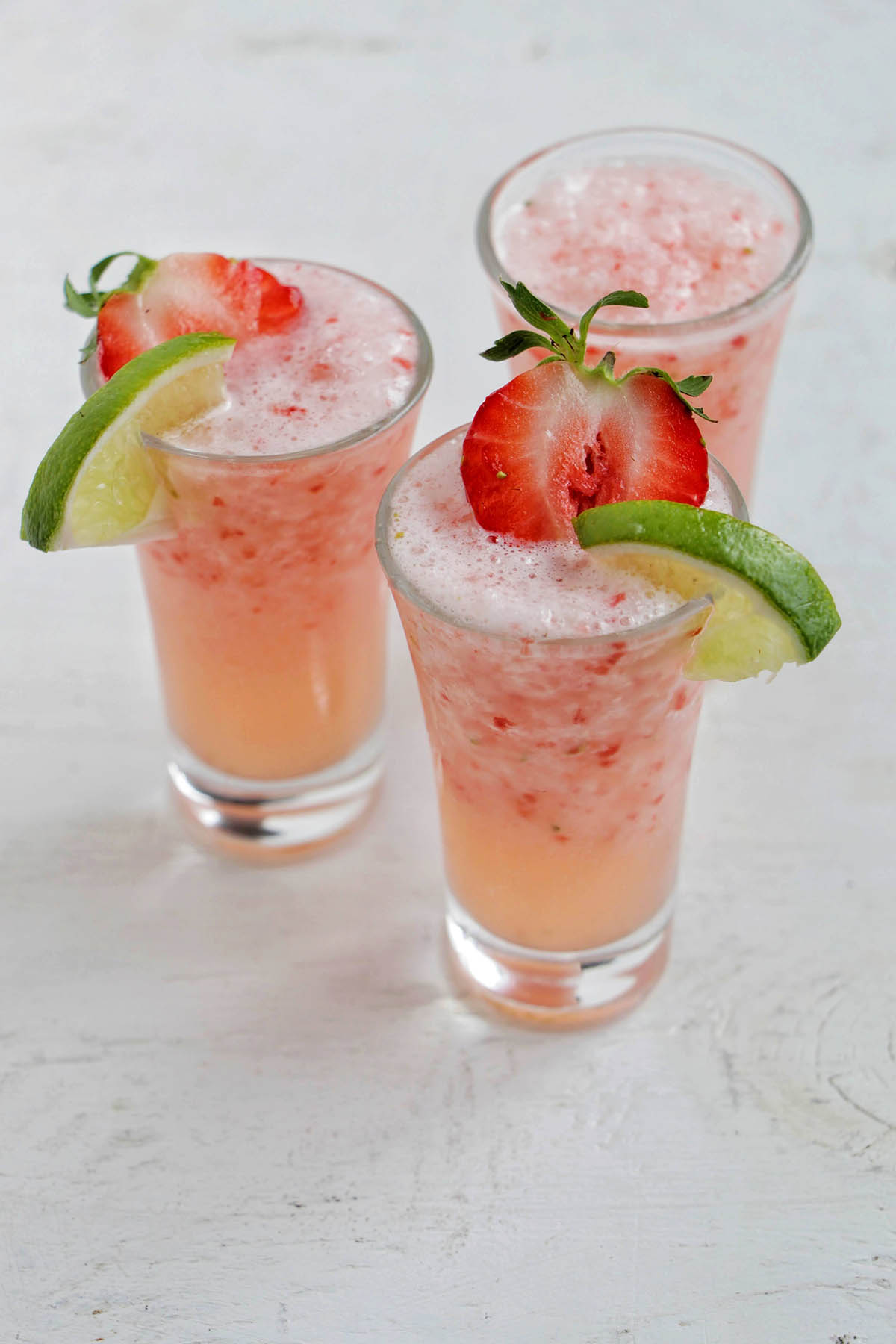 three blended strawberry daiquiri shots.