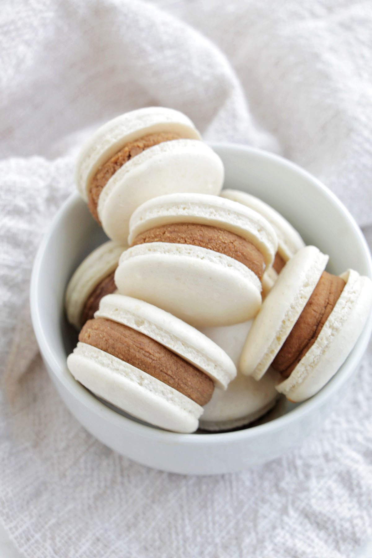 white chocolate macarons in a bowl.