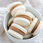 white chocolate macarons in a bowl.
