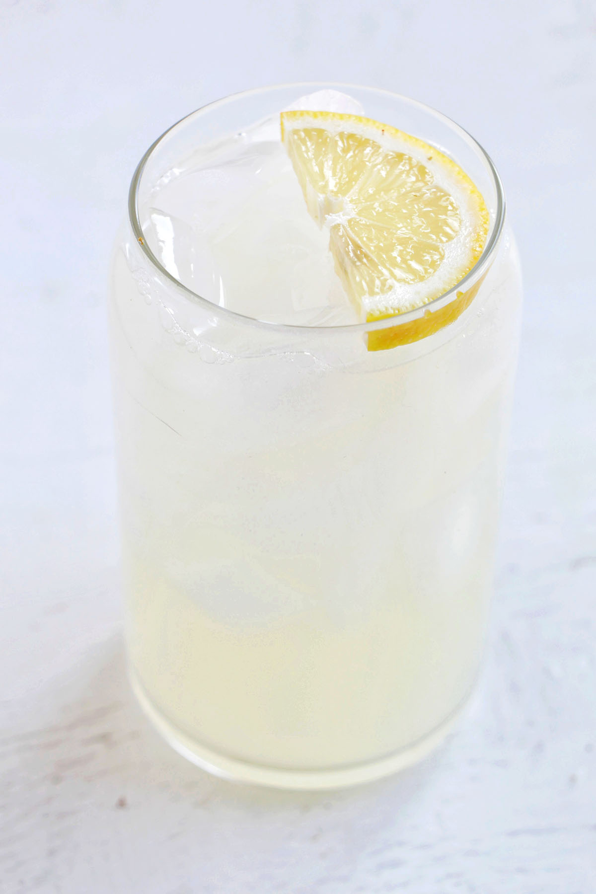 gin and lemonade with lemon garnish.