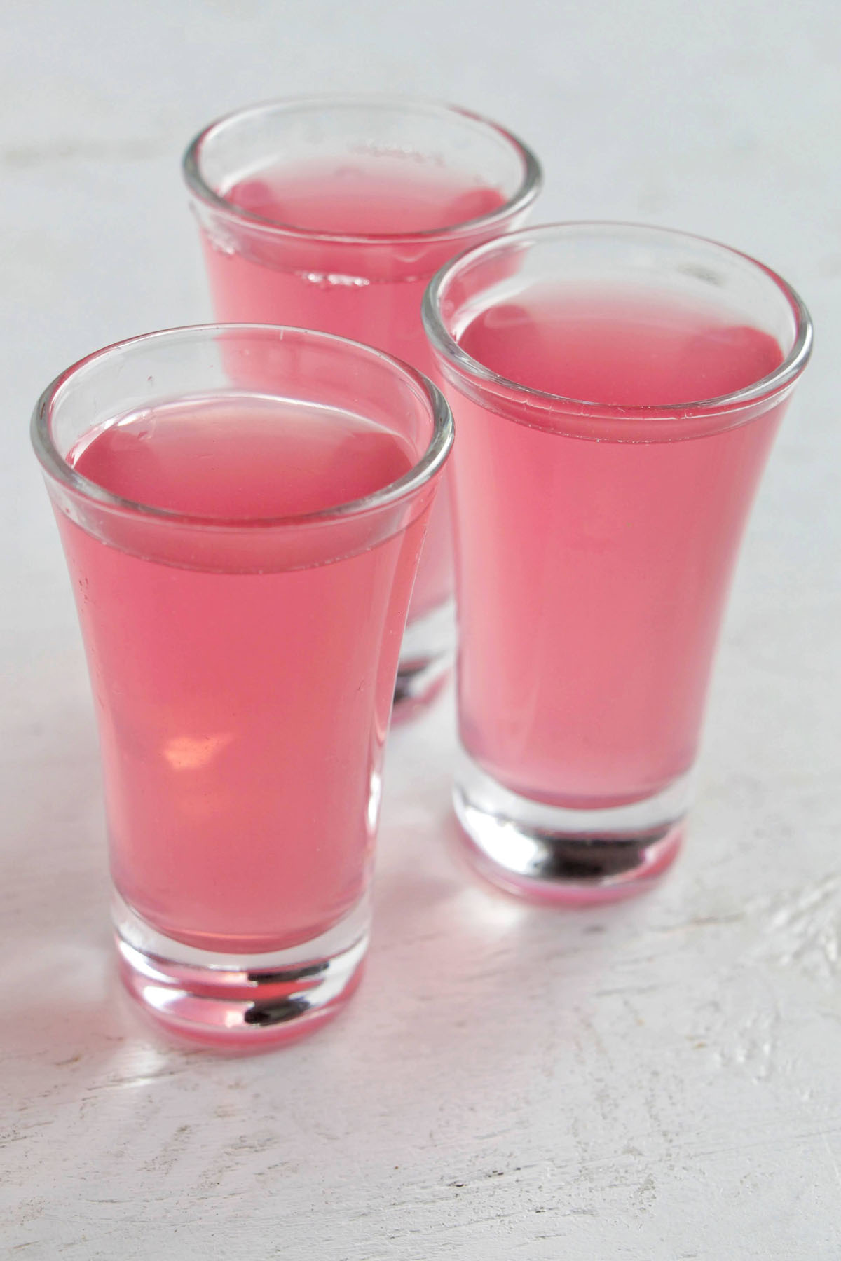 three pink lemonade shots.
