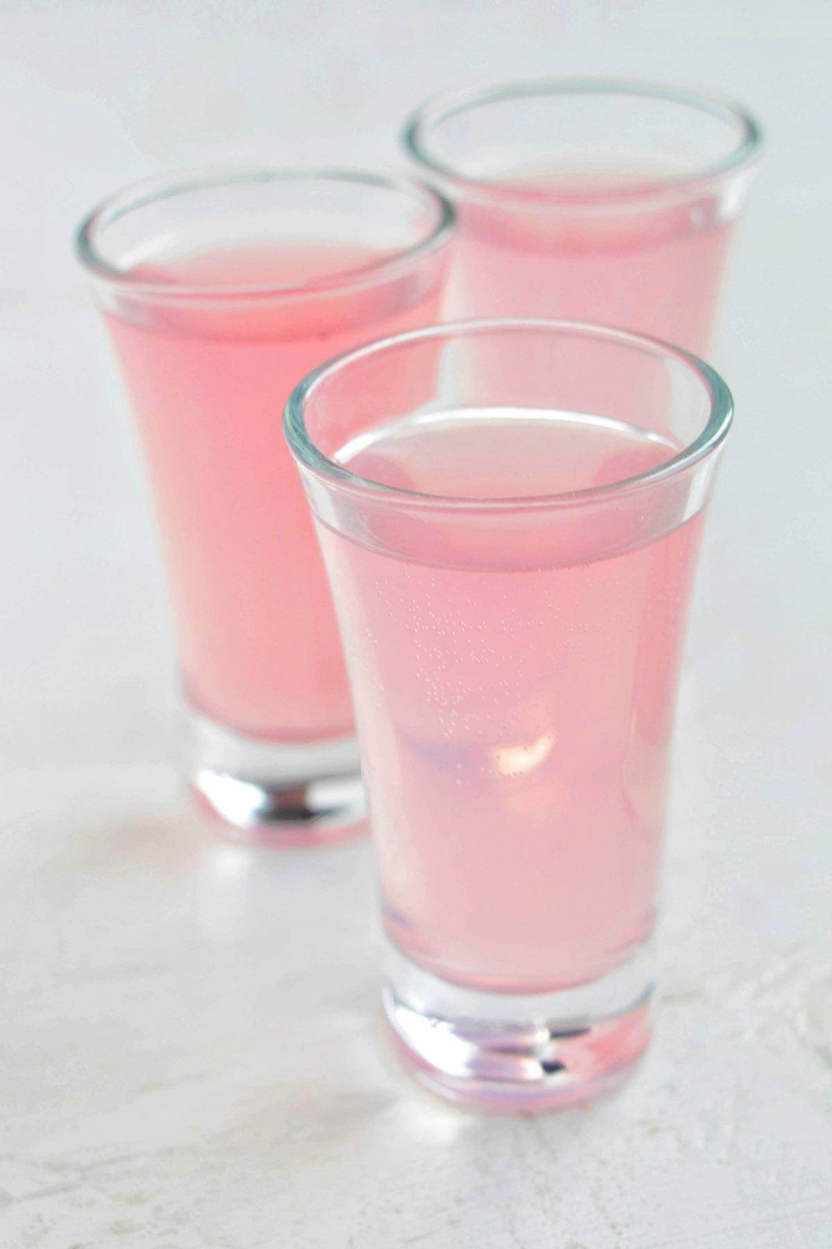 three pink spritz shots.