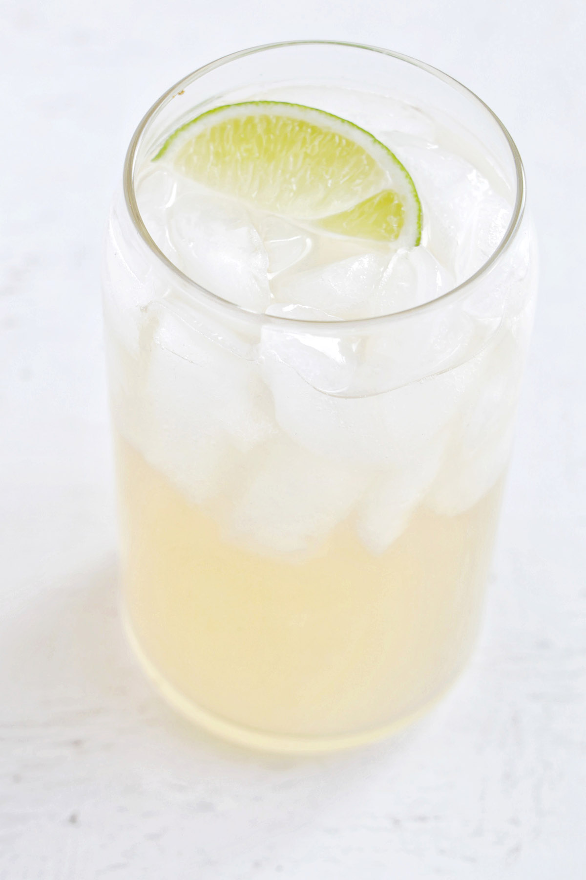 rum juice cocktail with lime garnish.