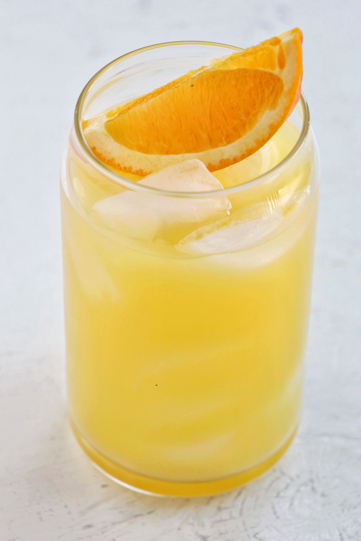 screwdriver drink with orange garnish.