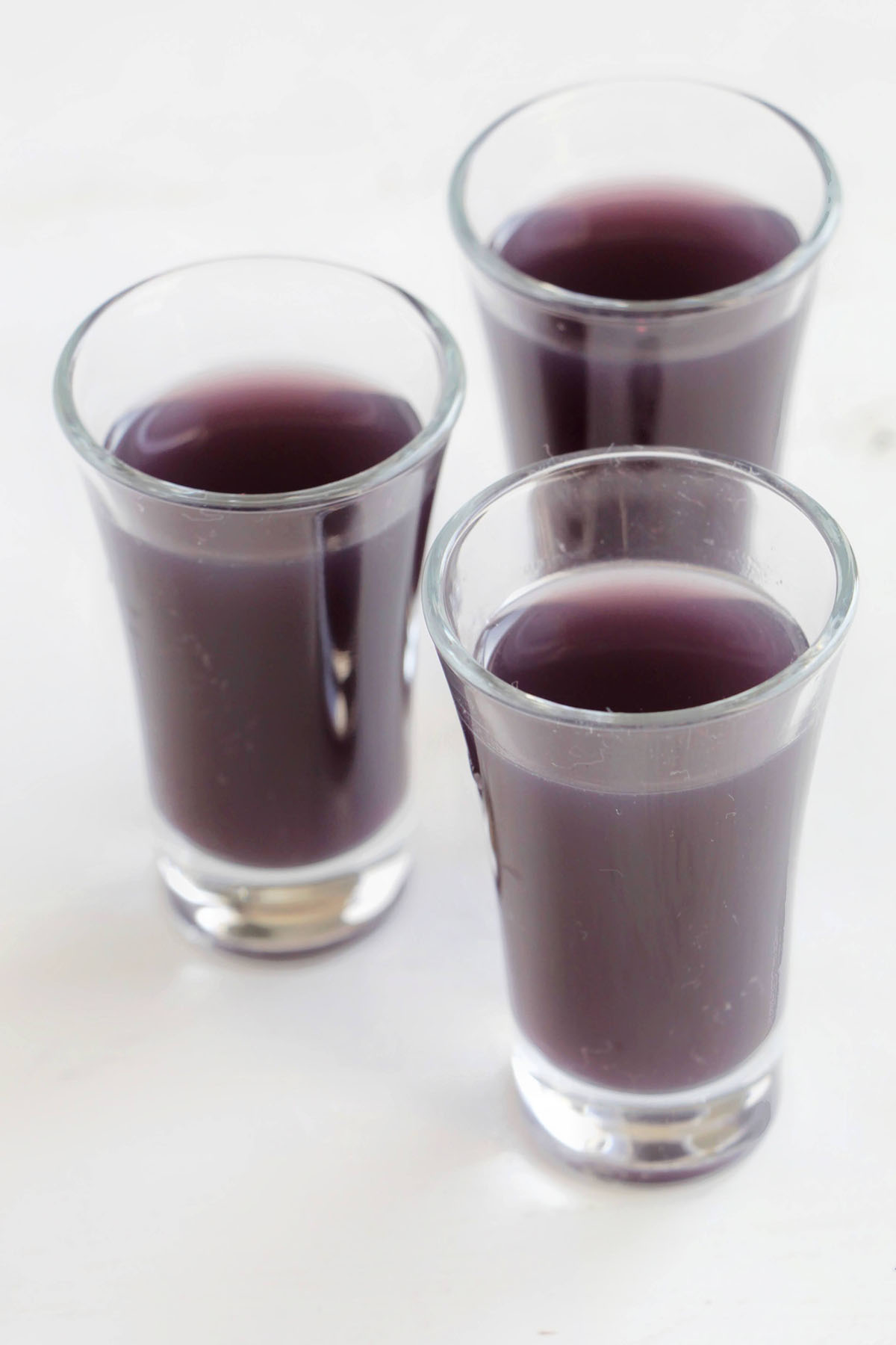 three purple Smirnoff berry blast shots.