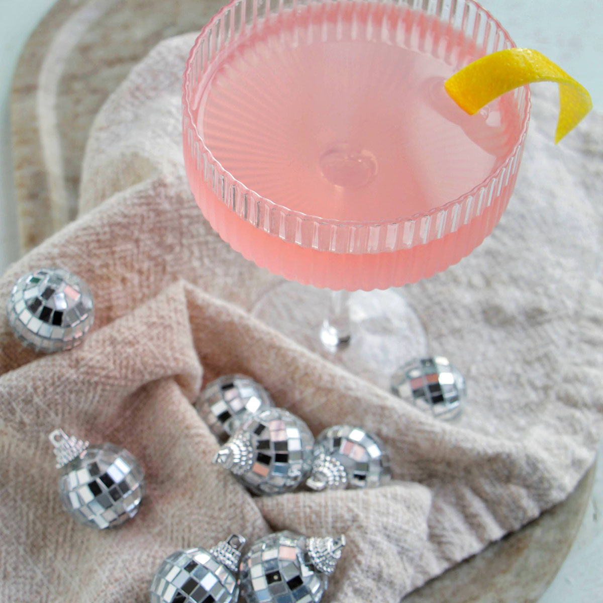 pink French blonde cocktail in a coupe glass.