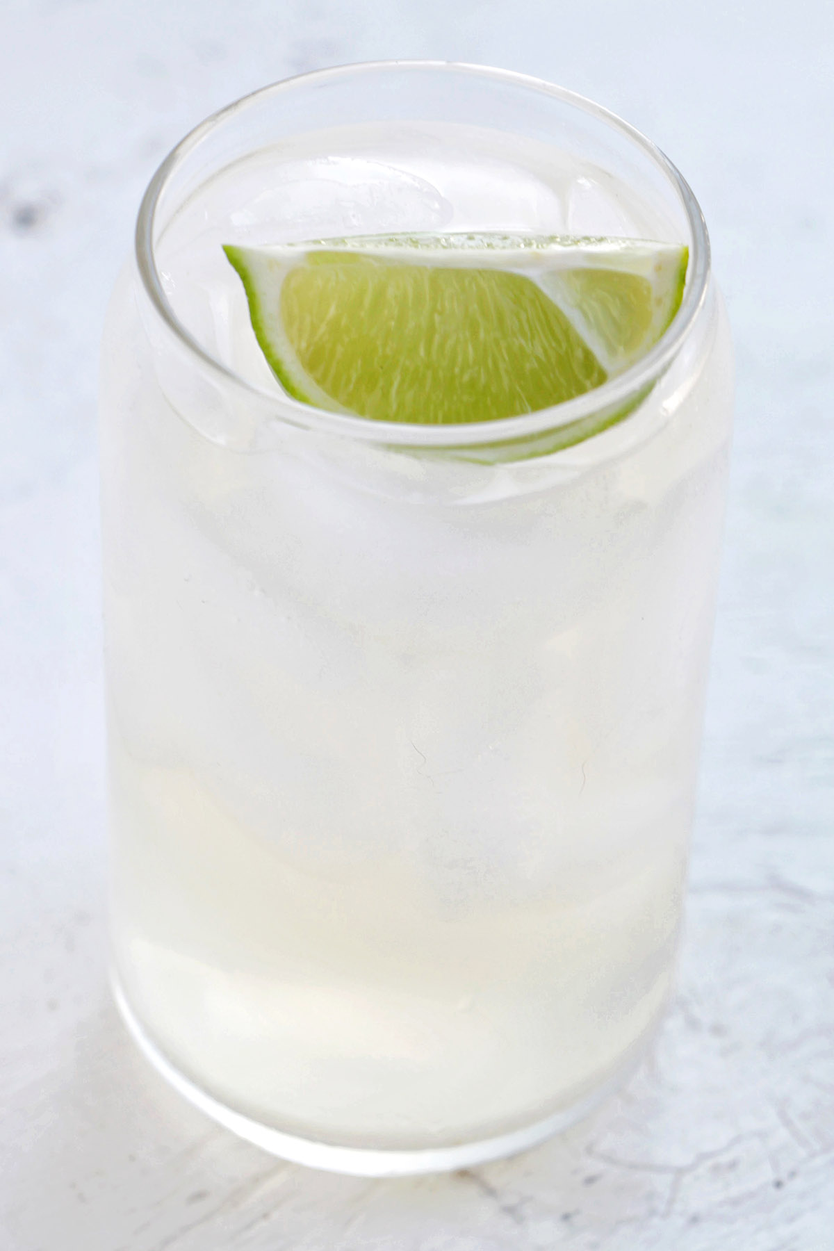 tequila and ginger ale with lime garnish.