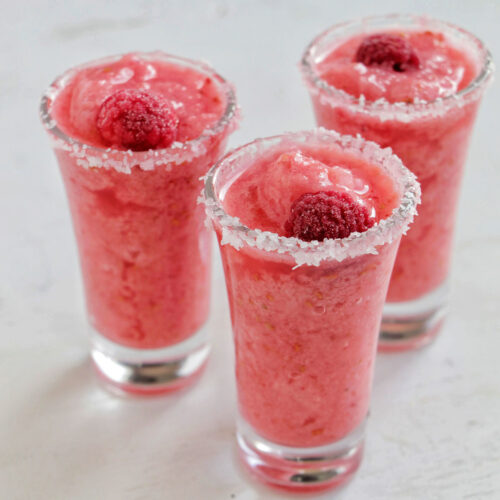 three blended raspberry margarita shots.