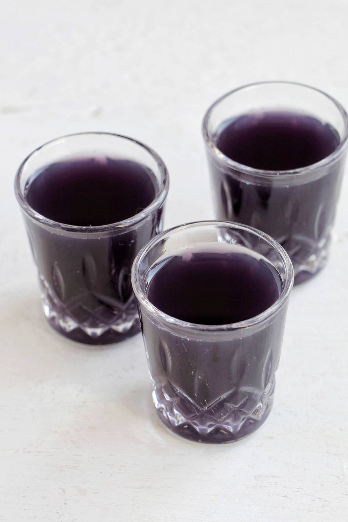 three violette daiquiri shots.