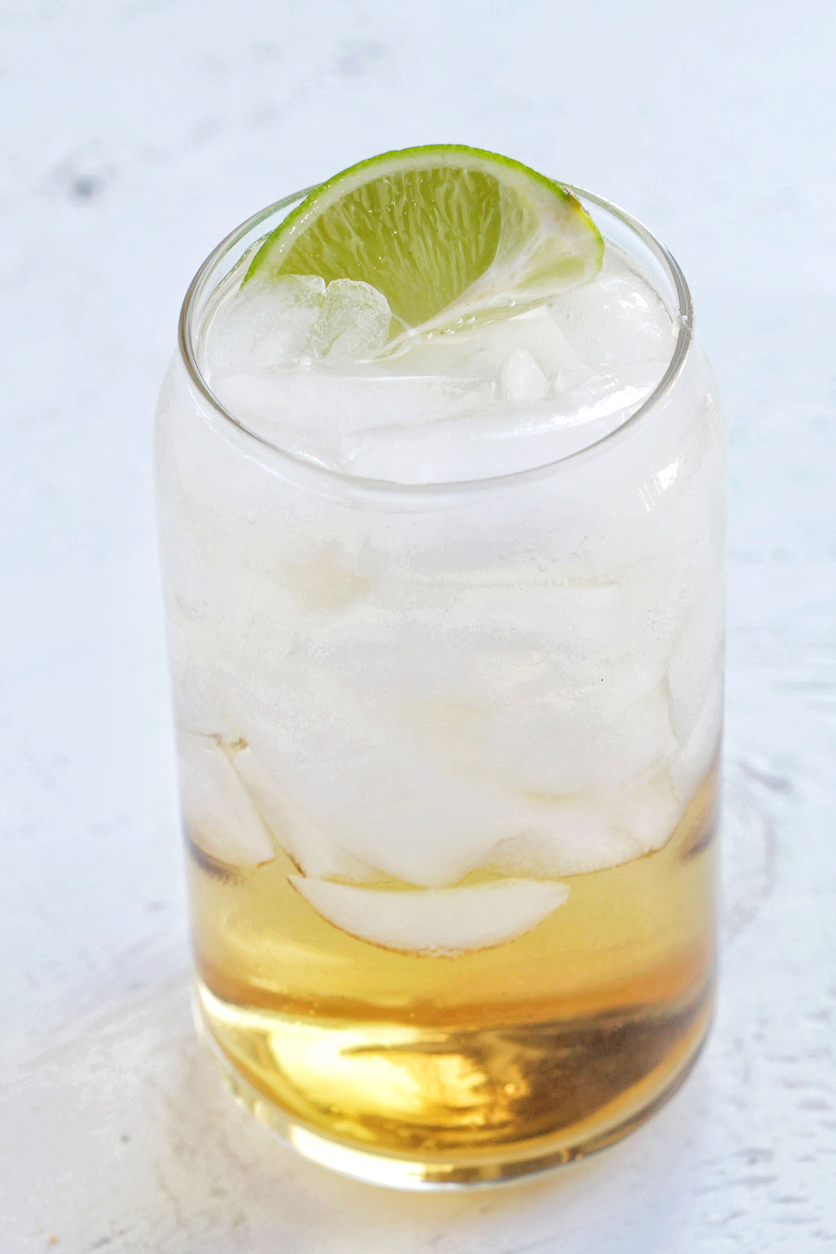 whiskey ginger beer with lime garnish.