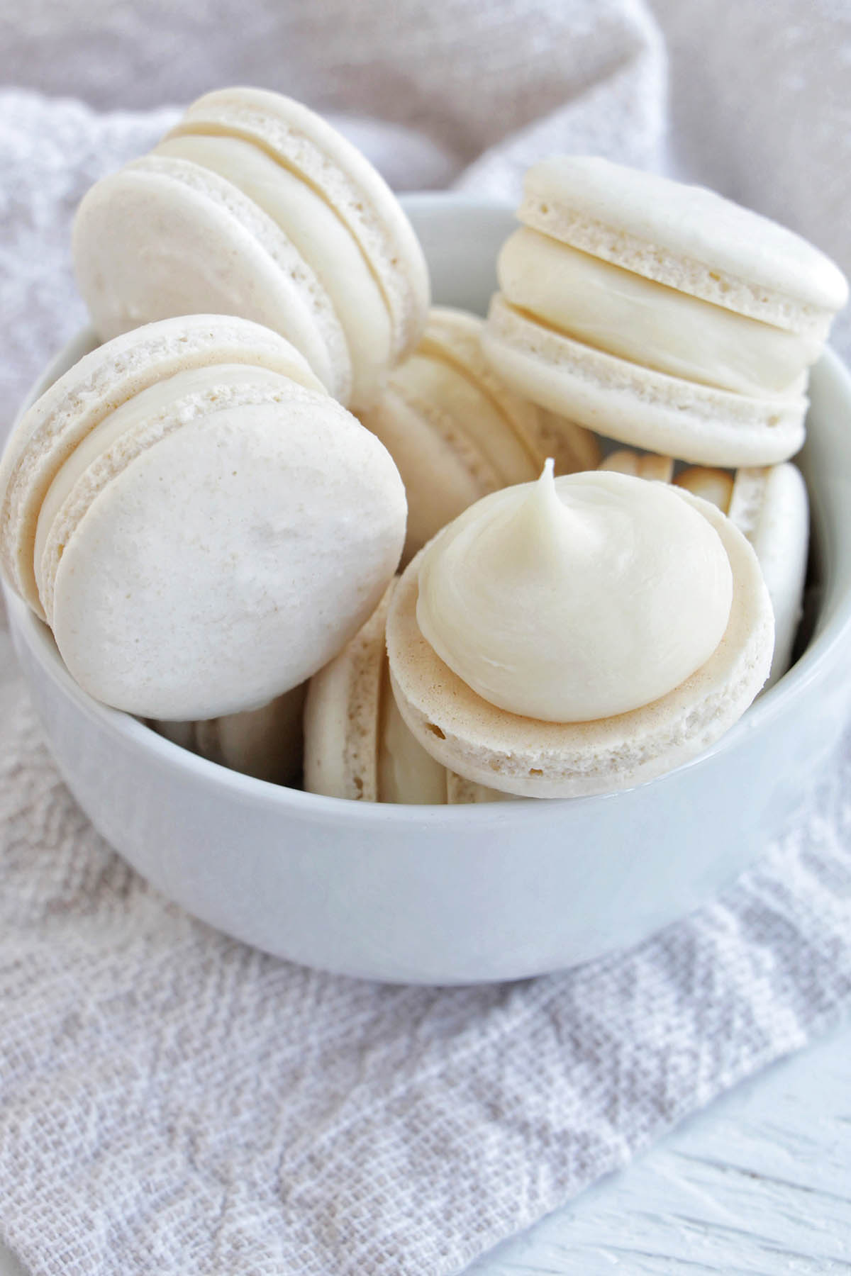 white macarons in a bowl.