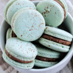 speckled light blue macarons with Cadbury egg ganache.