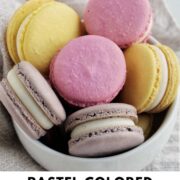 pastel colored macarons in a bowl with text overlay.