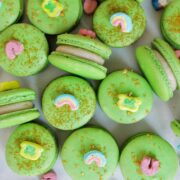St. Patrick's Day lucky charms macarons with text overlay.