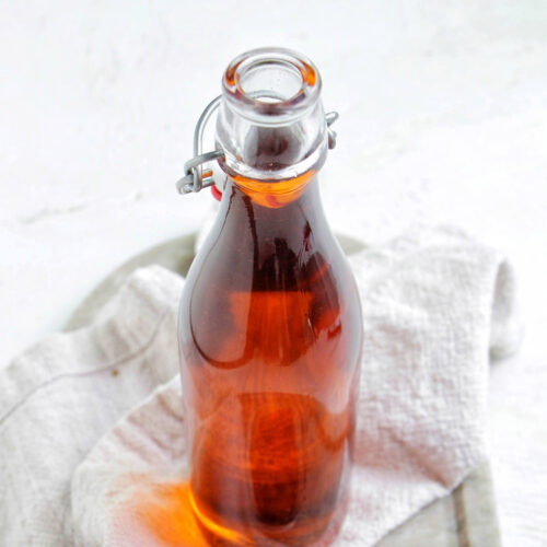 Calabrian chili oil in a glass bottle.