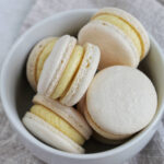 French meringue buttercream macarons in a bowl.
