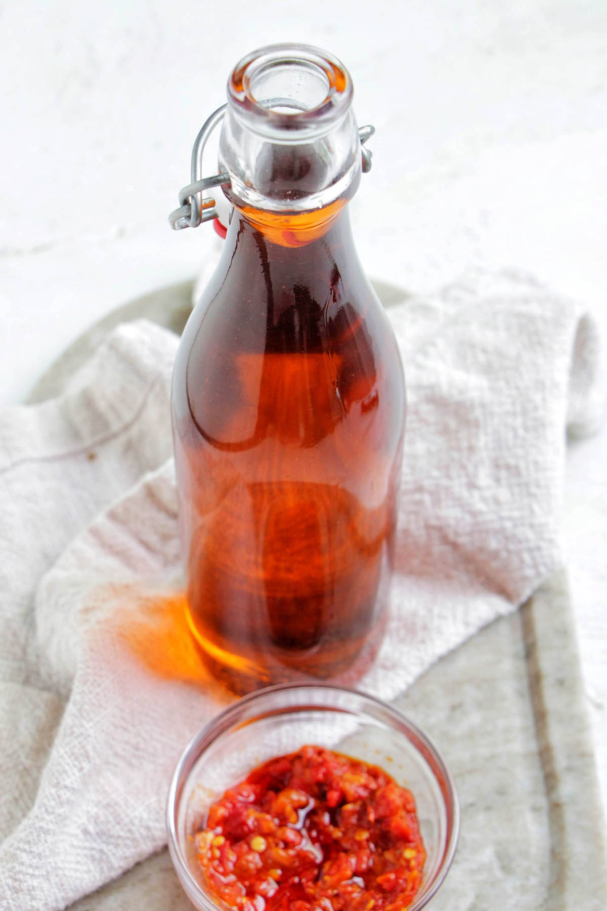 Calabrian chili oil in a glass bottle.