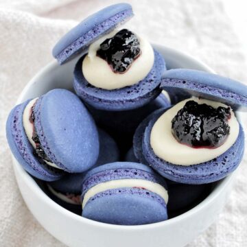 blueberry jam macarons in a bowl.