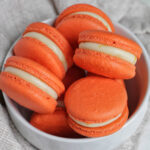 mimosa macarons in a bowl.