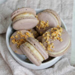 white chocolate macadamia nut macarons in a bowl.
