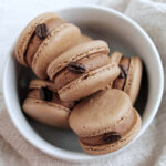 coffee macarons in a bowl.