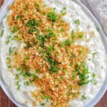 garlic cauliflower mash garnished with panko and chives.