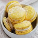 gooey butter cake macarons in a bowl.