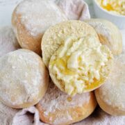 honey bread rolls in a basket with honey butter.