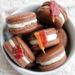 maple bacon macarons in a bowl.
