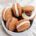 s'mores macarons in a bowl.