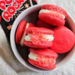 red Pop Rocks macarons in a bowl.