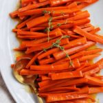 brown sugar glazed carrots on a serving tray.