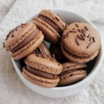 chocolate cake batter macarons in a bowl.