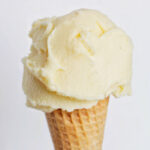 orange gelato on a cone.
