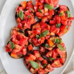 Italian tomato bruschetta on serving platter.