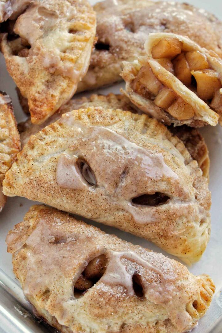 glazed apple hand pies on sheet tray.