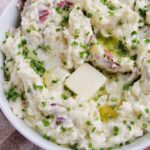 chunky mashed potatoes topped with chives.