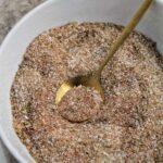 dry brine for turkey in a bowl with a spoon.