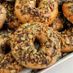seeded bagels on a tray.