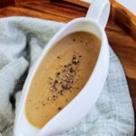 gravy with pepper in a gravy boat.