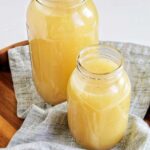two jars of turkey stock in mason jars.