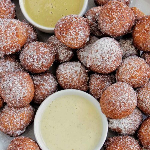 Italian ricotta donuts with two crème anglaise dipping sauce.