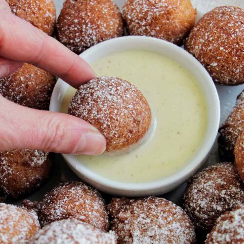 dipping donuts into vanilla crรจme anglaise sauce.