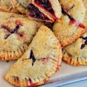 cranberry hand pies on sheet tray.