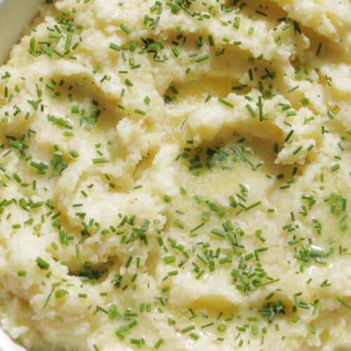 creamy mashed potatoes garnished with chives.