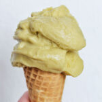 pistachio gelato on a cone.
