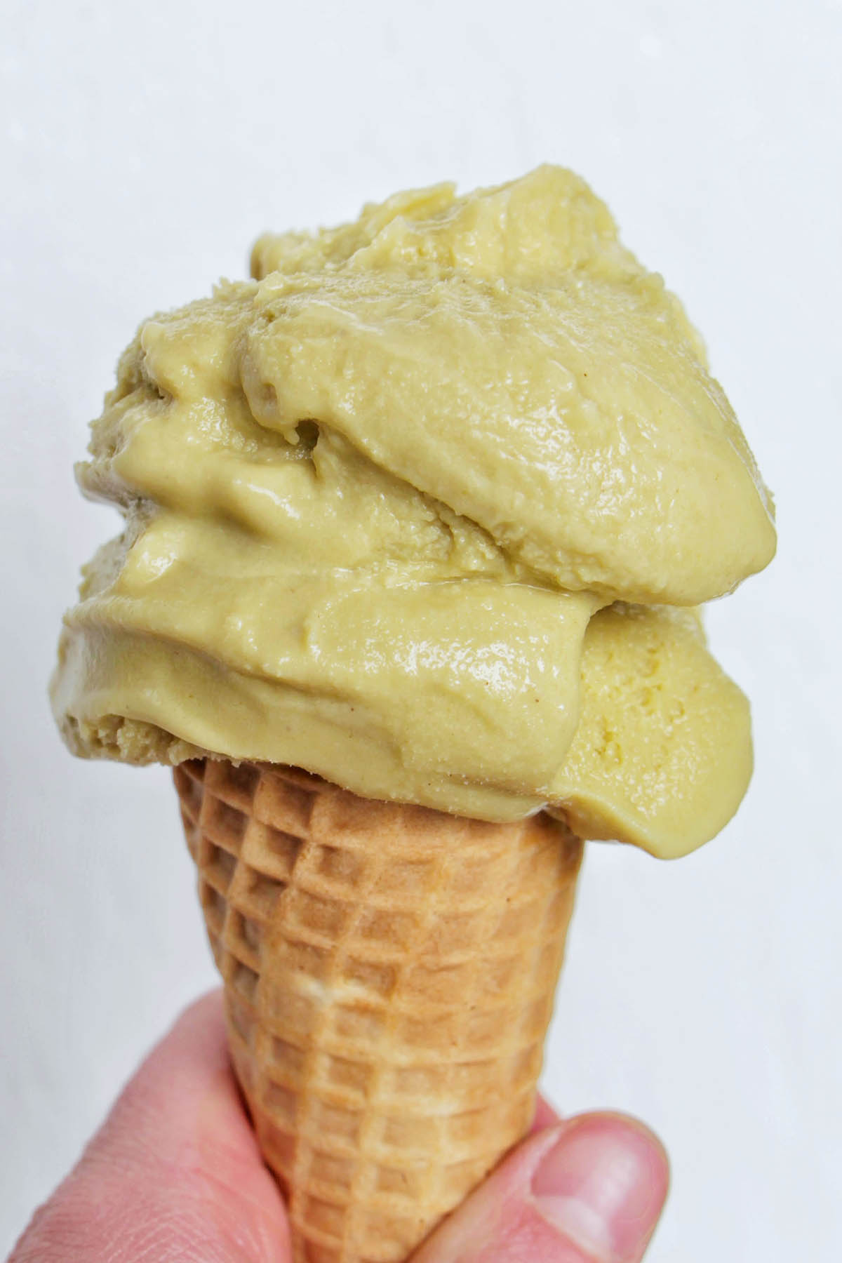 pistachio gelato on a cone.
