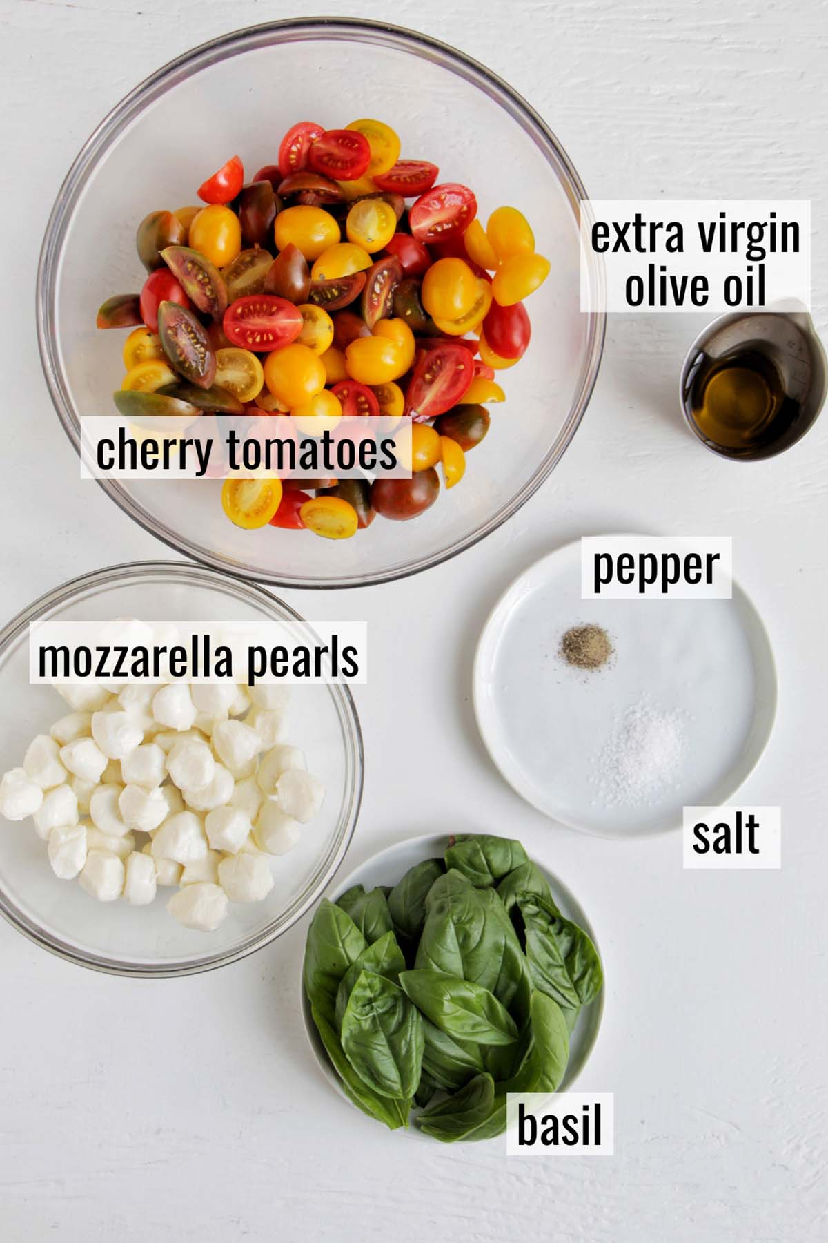 cherry tomato caprese salad ingredients with labels.