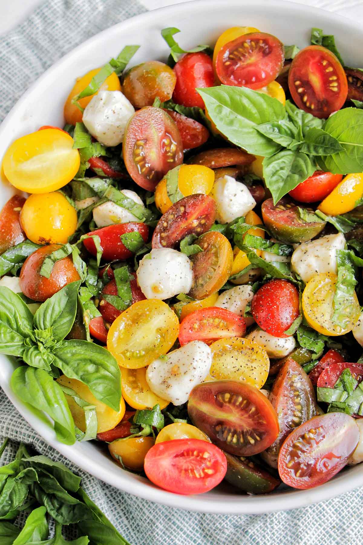 cherry tomato caprese salad in serving bowl.